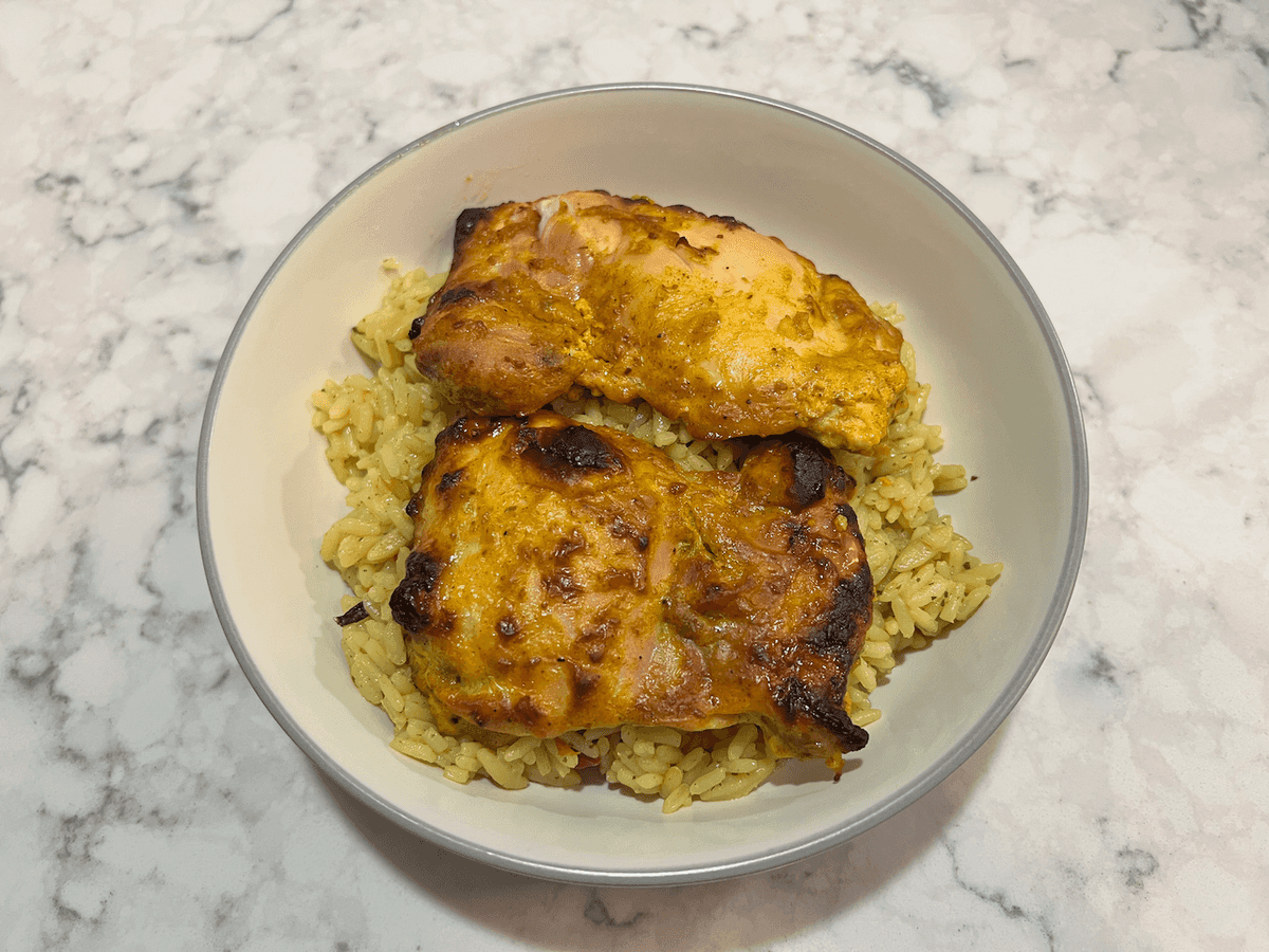 Tandoori chicken thigh over rice